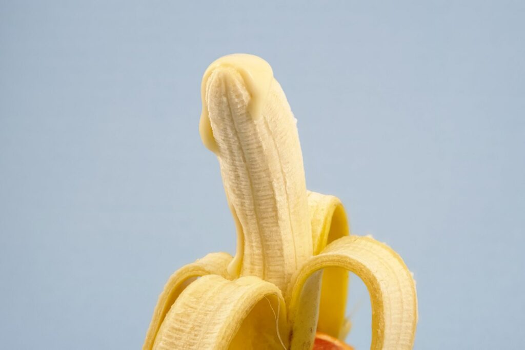 yellow banana fruit on white surface